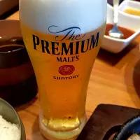思ひ出のまどかに透けて生ビール